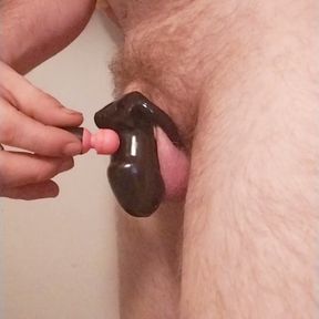 Chastity boy try to cum while in cage