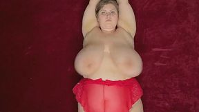 Kinky lingerie-clad BBW milf shakes her massive tits in wild solo play