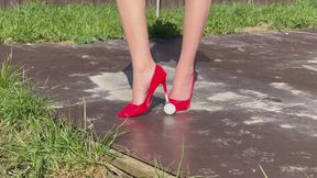 Girl in super big heels crushes eggs