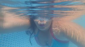 Long hair underwater and sensual bubble blowing