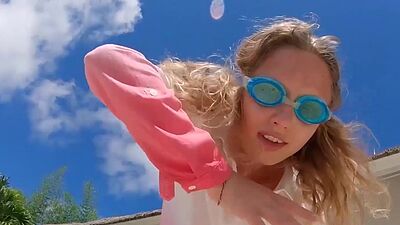 Skinny blonde ukrainian teen Clarise reveals her small tits in the pool