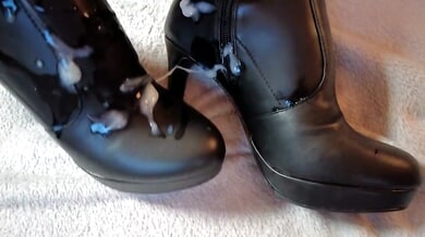 Mistress in black overknee boots gives a powerful footjob and covers her heels in cum