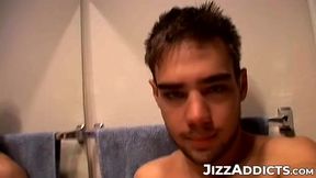 Horny Zack Randall strips off in the bathroom before rubbing his cock