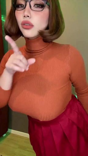 Female performer in red dress and orange turtleneck