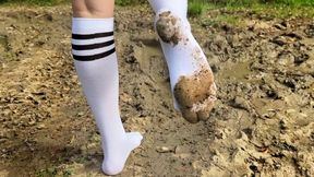 White knee high socks in mud, muddy stockings, black stockings in mud, girl in stockings in mud, white socks in mud, black stockings messy, dirty feet, dirty white socks