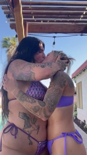 Lesbian tongue kissing in tiny bikinis
