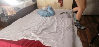 Sexy brunette doing naked chores around the house.