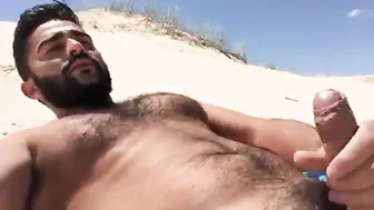Straight hunk jerks his big cock on a sunny Greek beach
