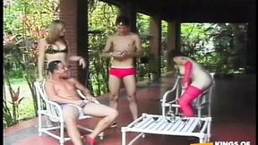 Two guys rough up their slutty girlfriends' butts outside