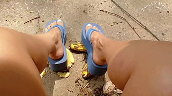 Crushing fruit in big flipflops