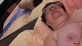 Horny old woman masturbates at home with a dildo