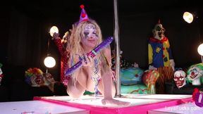 Clown Leya Falcon plays with a big purple dildo