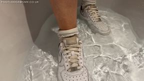 Getting my white socks and Nike sneakers soaking wet in the bath