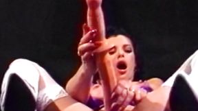 Gorgeous lesbian strips down and impales her pussy and ass