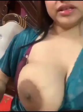 Busty babe shows off her big nipples and tits