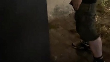 Helping him pee in the street