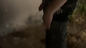 Helping him pee in the street