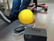 Male Shoeplay with beach ball in Under Armor, Vans Slip Ons, Black Socks
