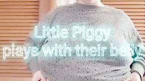 Little Piggy plays with their belly