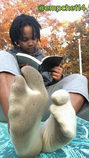 Ebony Goddess ignores you as She wiggles Her stinky socks in your face