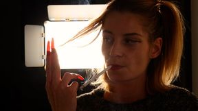 Eve’s elegant long-cigarette smoking tease and striking red nails