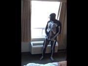 skeleton jerking off at hotel window watching truck drivers get ready for work