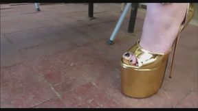 Tara in sexy gold platform heels