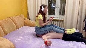 Sofi fullweight jeanssitting on tied slave and listens to music showing countdown of ass stifling