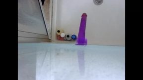 Dildo ass fucking in the shower