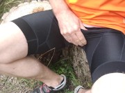 A cyclist in bib shorts is jerking off a cock and swallow cum.
