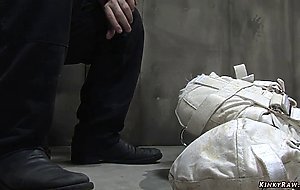 Brunette psycho bound in straitjacket