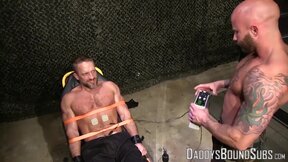 Hot military guy Dirk Caber loves being tied up to a table and tormented