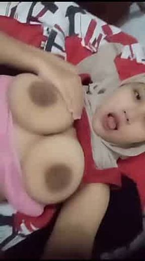 Asian teasing with big tits and tongue