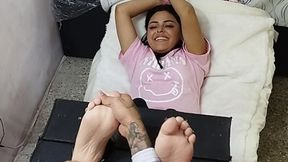 Genesis is tickled on her soles