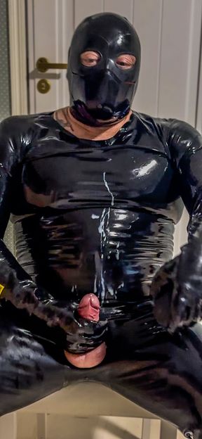 Rubber Man in Latex Catsuit and Penis Pump