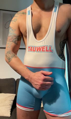 Smooth jock in wrestling singlet jerks off and cums
