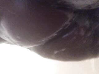 Large butt all soaped up in the shower