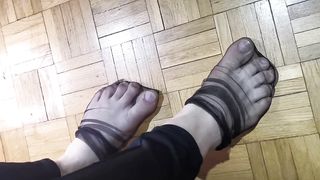 Toes dancing in black nylons