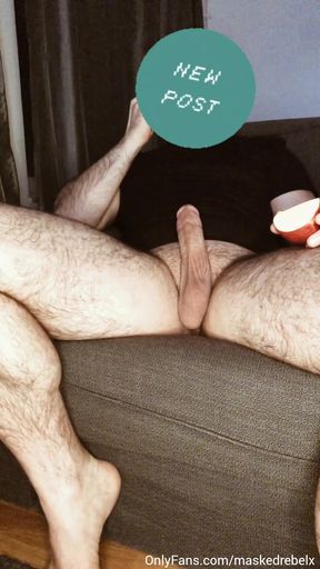 Hairy hunk plays with his fat cock while eating an apple