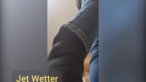Desperate guy pees in his jeans and strips
