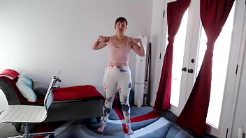 Goddess Aurora Willows bends over in yoga class