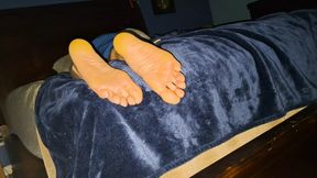 Showing off my soft soles while I'm in bed
