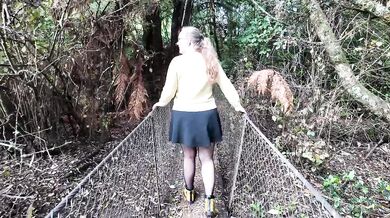 MILF masturbates in woods while someone watches her big tits squirm