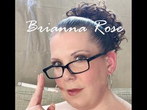 Lounging in a navy tie front halter smoking a VS full flavor menthol 100