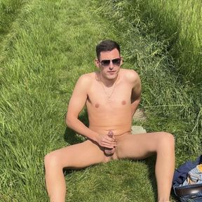 German twink jerks off naked outside until he cums