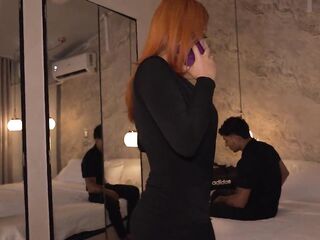 A breasty redhead has no choice but to share the same hotel daybed with her roommate.