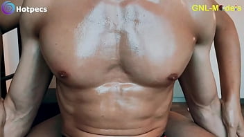 Enjoying a hot oil massage to his hot pecs and pointy nipples!