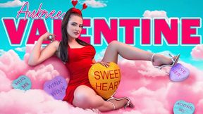 Brunette in red dress opens gift box amid heart balloons and Valentine streamers