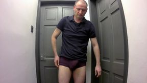 Jonathan gets out his erect shaved uncut cock as he strips naked masturbating