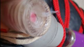 Post orgasm wand torment in leather bondage sack